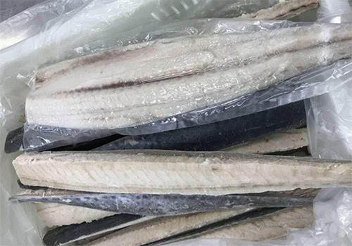 Spanish mackerel fillets showing pale flesh and skin-on edges